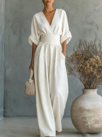 ELEGANTE MONO CON ESCOTE EN V Y CINTURA ALTA